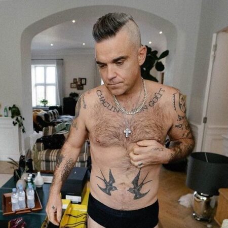 Robbie Williams Reage Ativamente à Reunião do Oasis